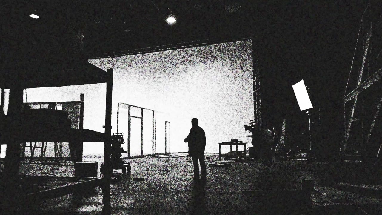 Camera and lighting equipment on a studio production set